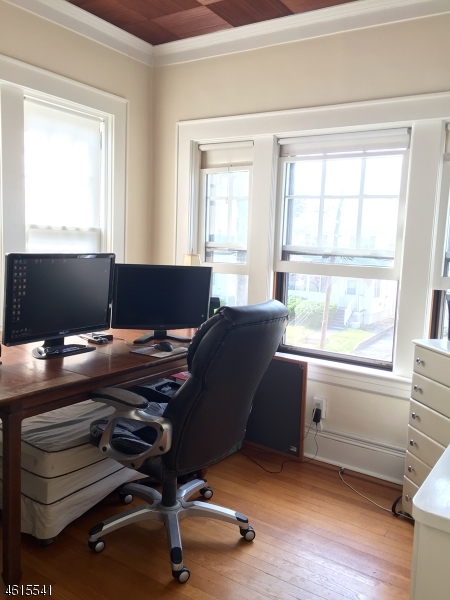 12 Orchard Road, Unit 2 Maplewood, NJ 07040 - Photo 8 of 11 a view of a workspace with furniture and a window