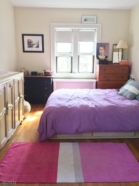 12 Orchard Road, Unit 2 Maplewood, NJ 07040 - Photo 9 of 11 a bedroom with a bed and a window