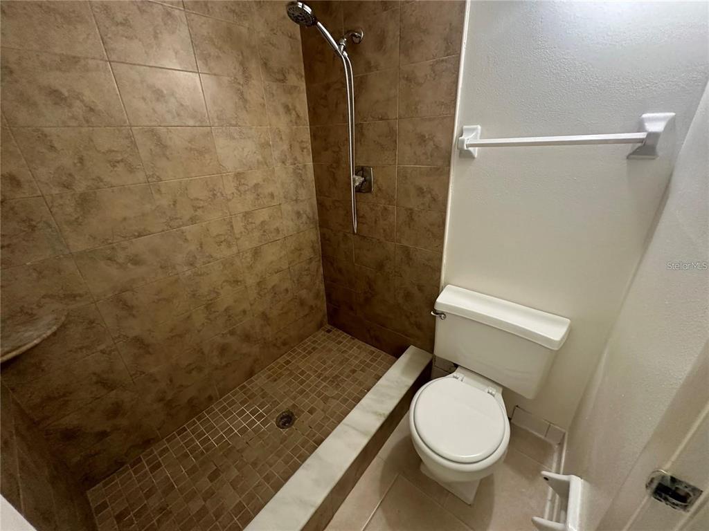 600 Cranes Way, Unit 103 Altamonte Springs, FL 32701 - Photo 11 of 17 a bathroom with a toilet and a shower