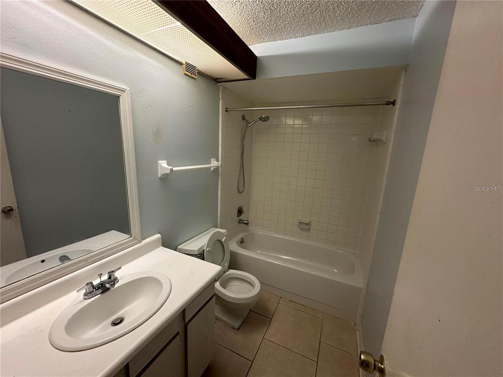600 Cranes Way, Unit 103 Altamonte Springs, FL 32701 - Photo 14 of 17 a bathroom with a sink toilet and shower