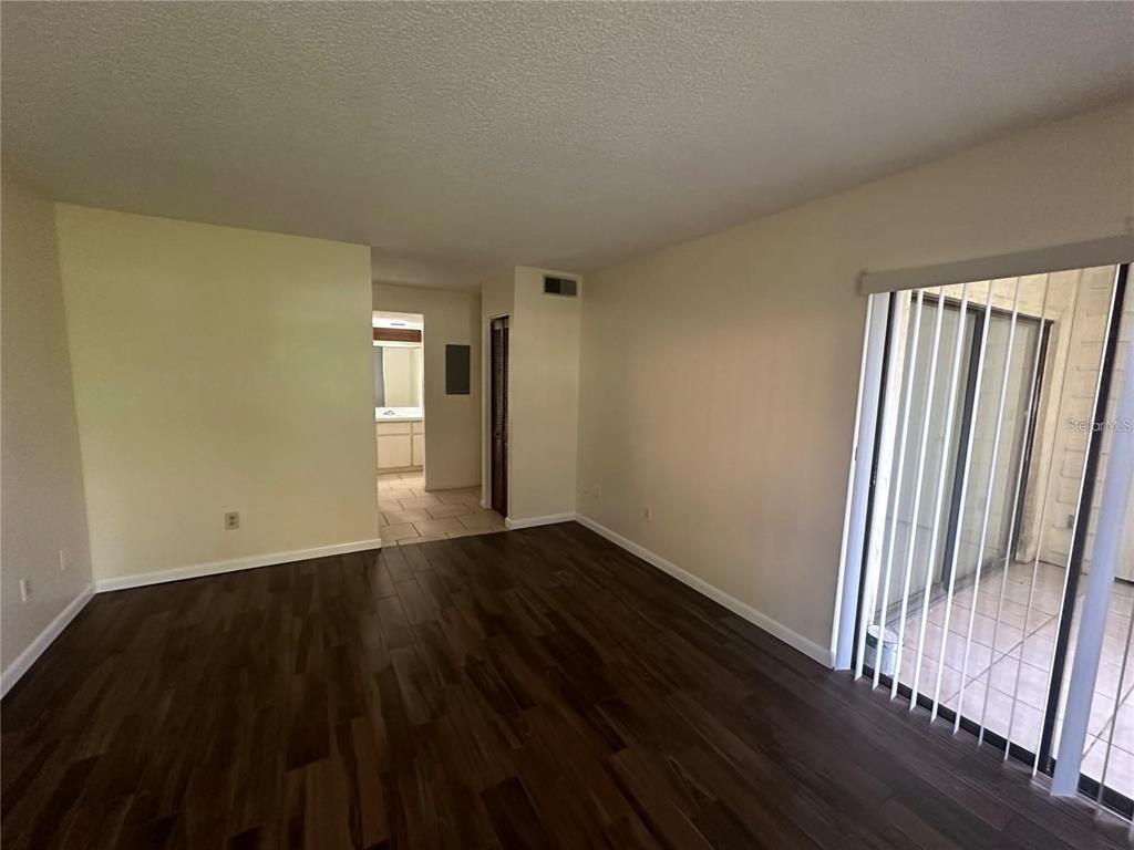 600 Cranes Way, Unit 103 Altamonte Springs, FL 32701 - Photo 8 of 17 a view of an empty room and wooden floor