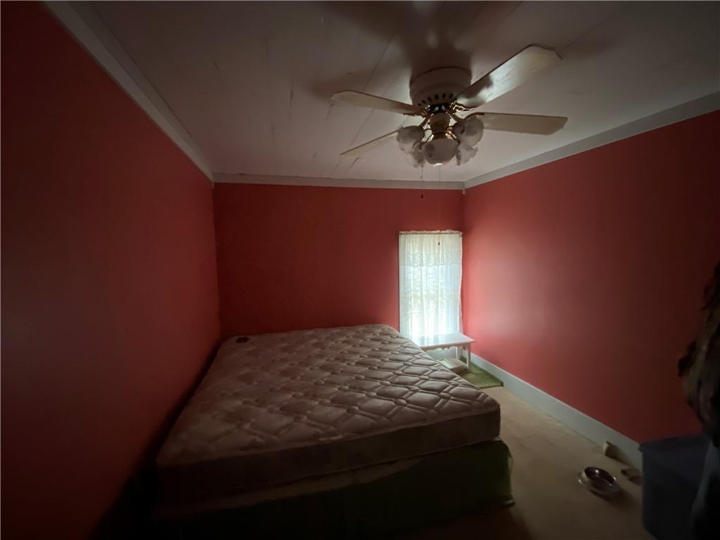 0 North Loop Road Dayton, PA 16256 - Photo 13 of 14 a bedroom with a bed and a chandelier