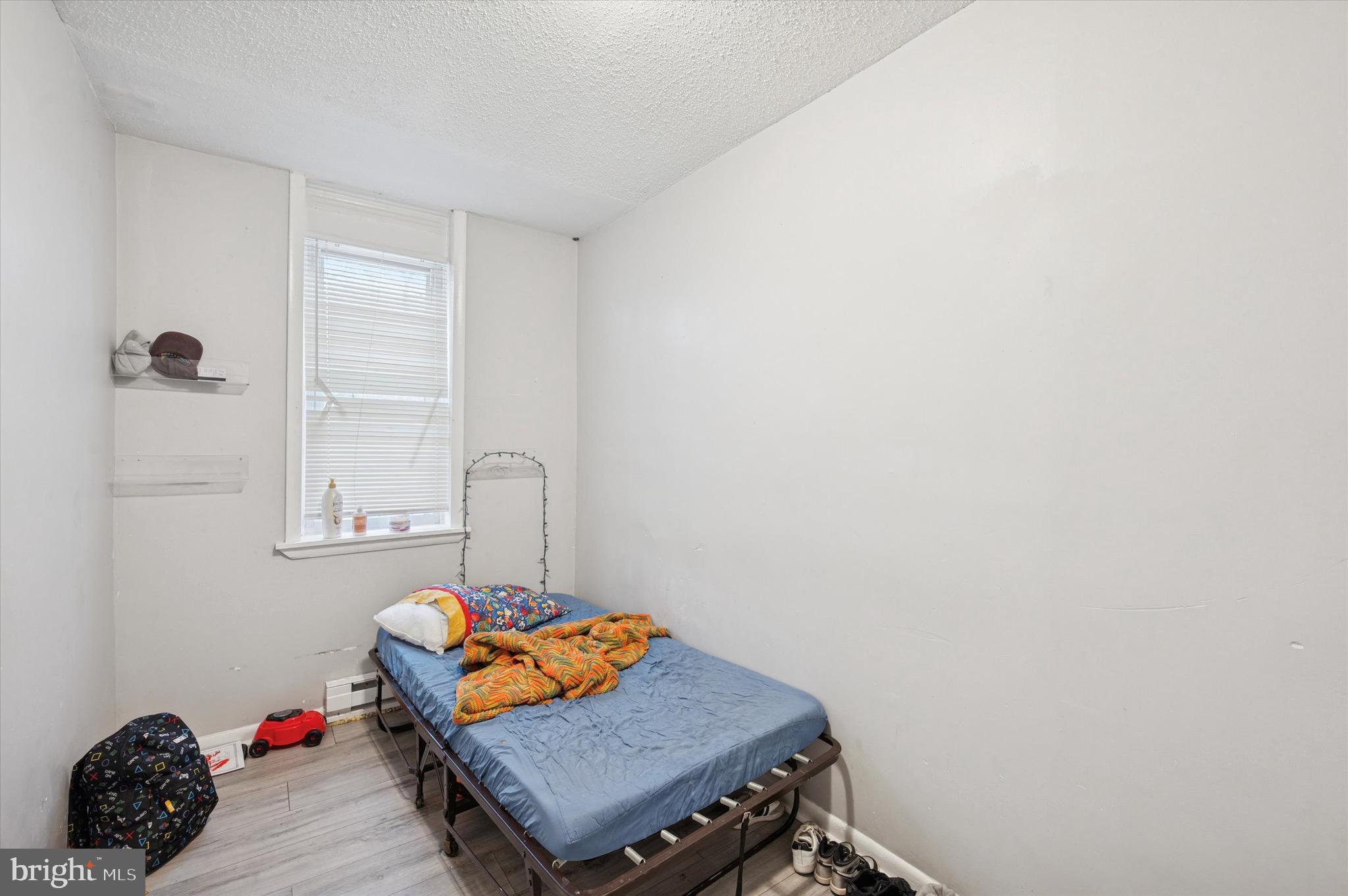 425 Main Street Darby, PA 19023 - Photo 17 of 18 a living room with a couch and a window