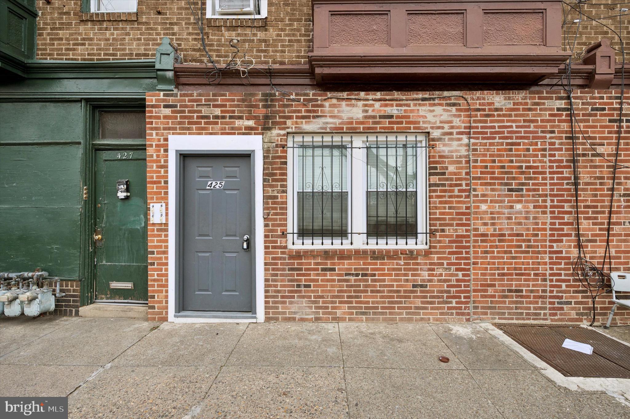 425 Main Street Darby, PA 19023 - Photo 2 of 18 a view of a brick house with large windows