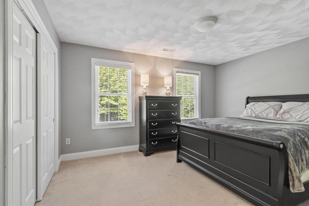 4 Forest Street Georgetown, MA 01833 - Photo 30 of 37 a bedroom with a bed and a closet