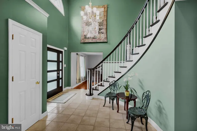 a kitchen with stainless steel appliances granite countertop wooden cabinets a stove a sink and a microwave