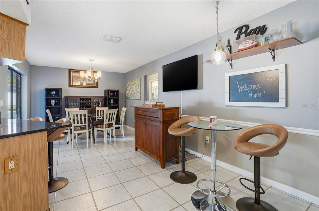23209 Blue Ridge Place Land O' Lakes, FL 34639 - Photo 15 of 54 a view of a livingroom with furniture and a flat screen tv