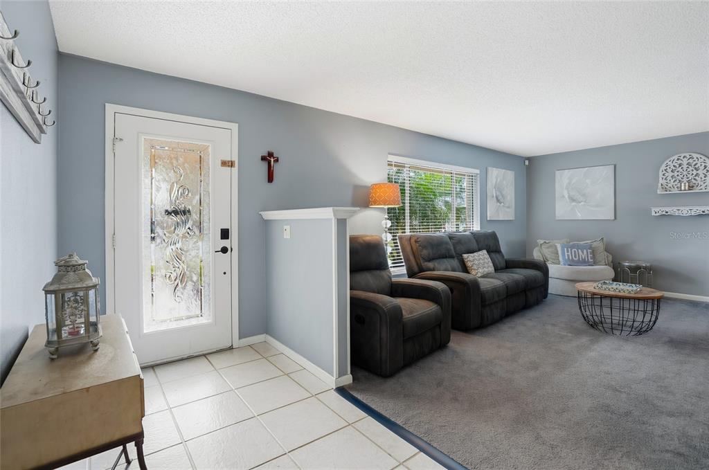 23209 Blue Ridge Place Land O' Lakes, FL 34639 - Photo 4 of 54 a living room with furniture and a window