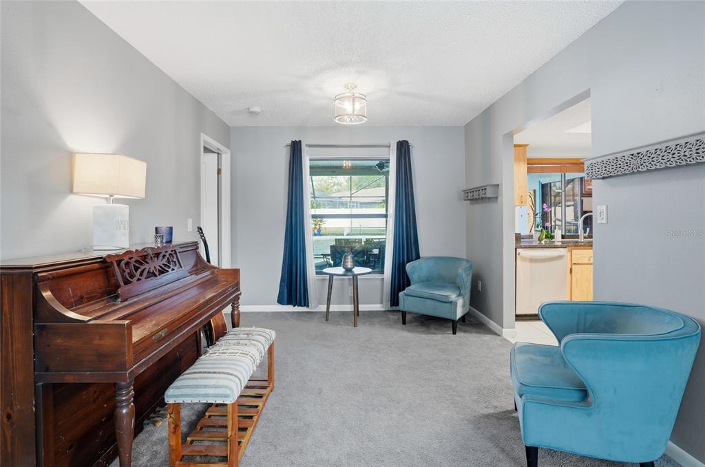 23209 Blue Ridge Place Land O' Lakes, FL 34639 - Photo 7 of 54 a bedroom with furniture and a window