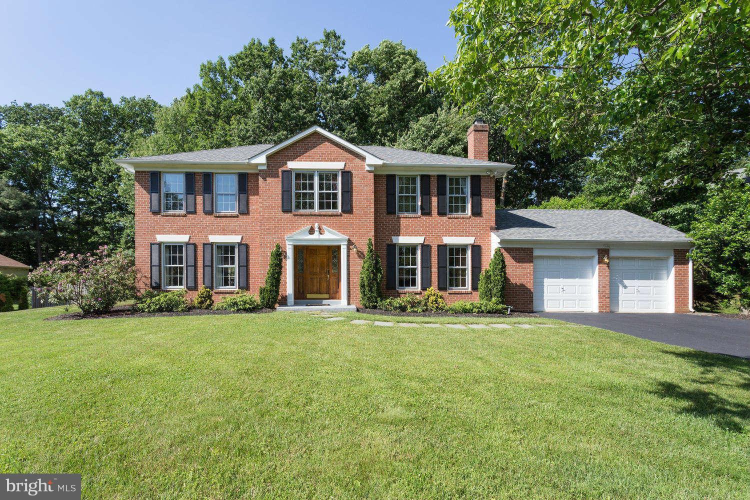 1524 Laurel Hill Road Vienna, VA 22182 - Photo 1 of 29 a front view of a house with a garden