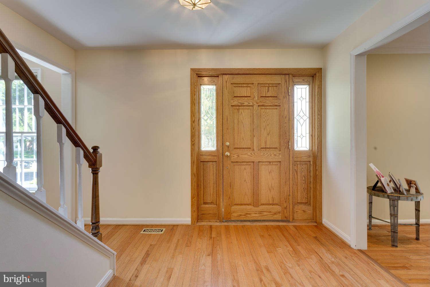 1524 Laurel Hill Road Vienna, VA 22182 - Photo 2 of 29 a view of empty room with wooden floor and fan