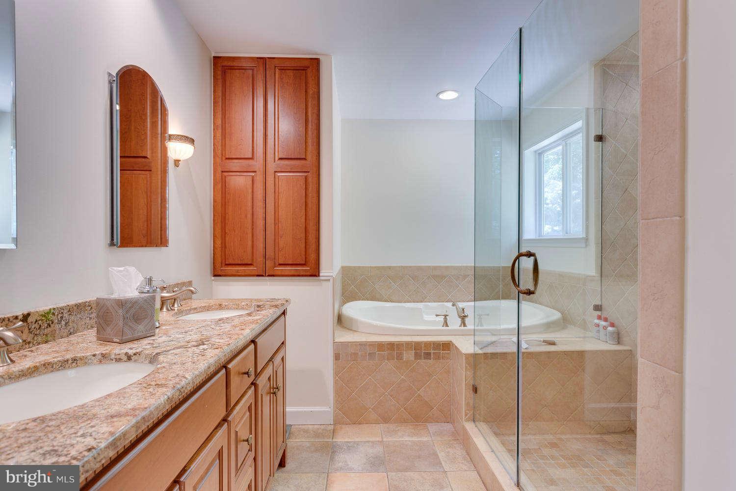 1524 Laurel Hill Road Vienna, VA 22182 - Photo 11 of 29 a bathroom with a double vanity sink and a mirror