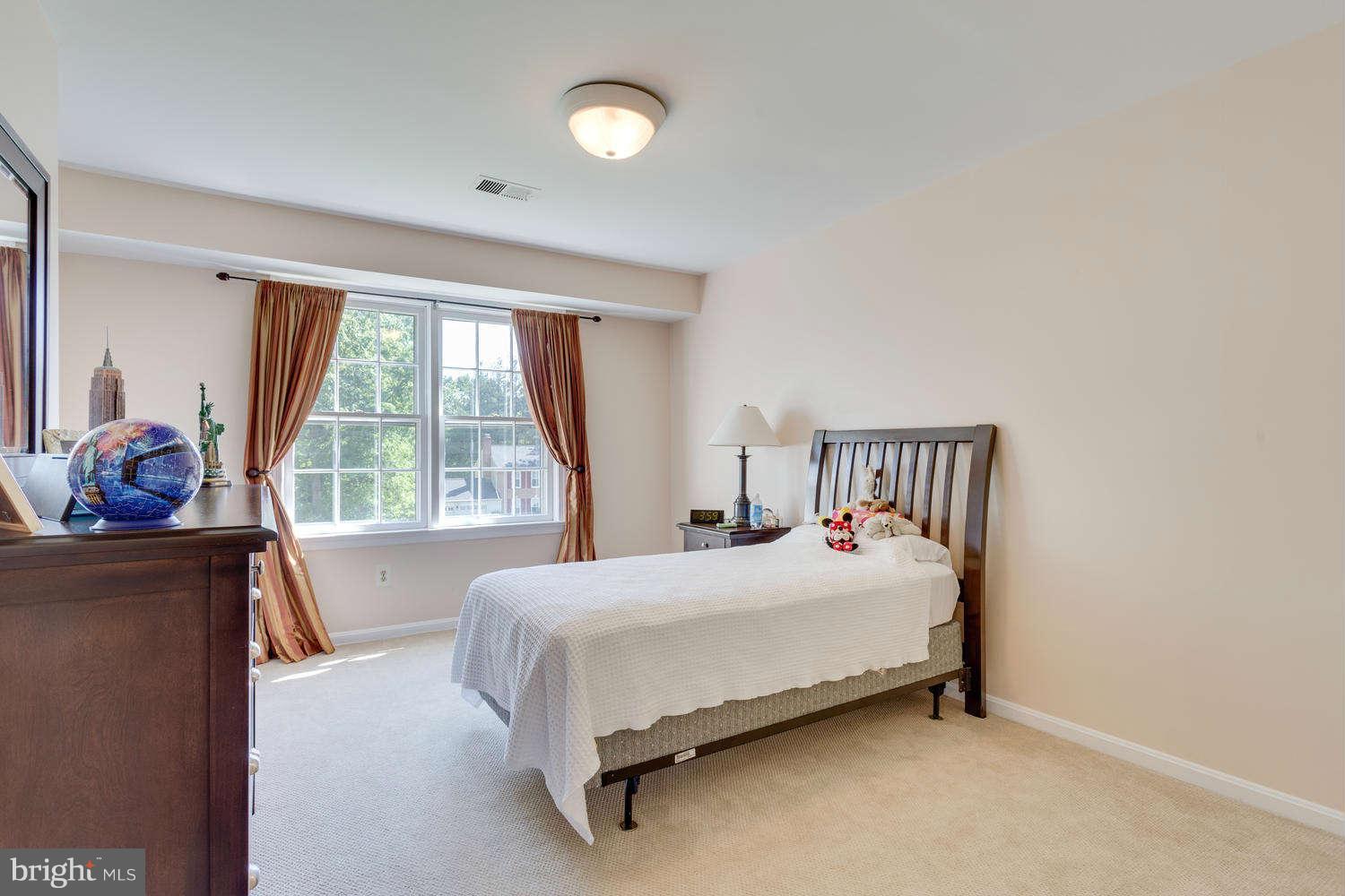 1524 Laurel Hill Road Vienna, VA 22182 - Photo 15 of 29 a bedroom with a bed and a window