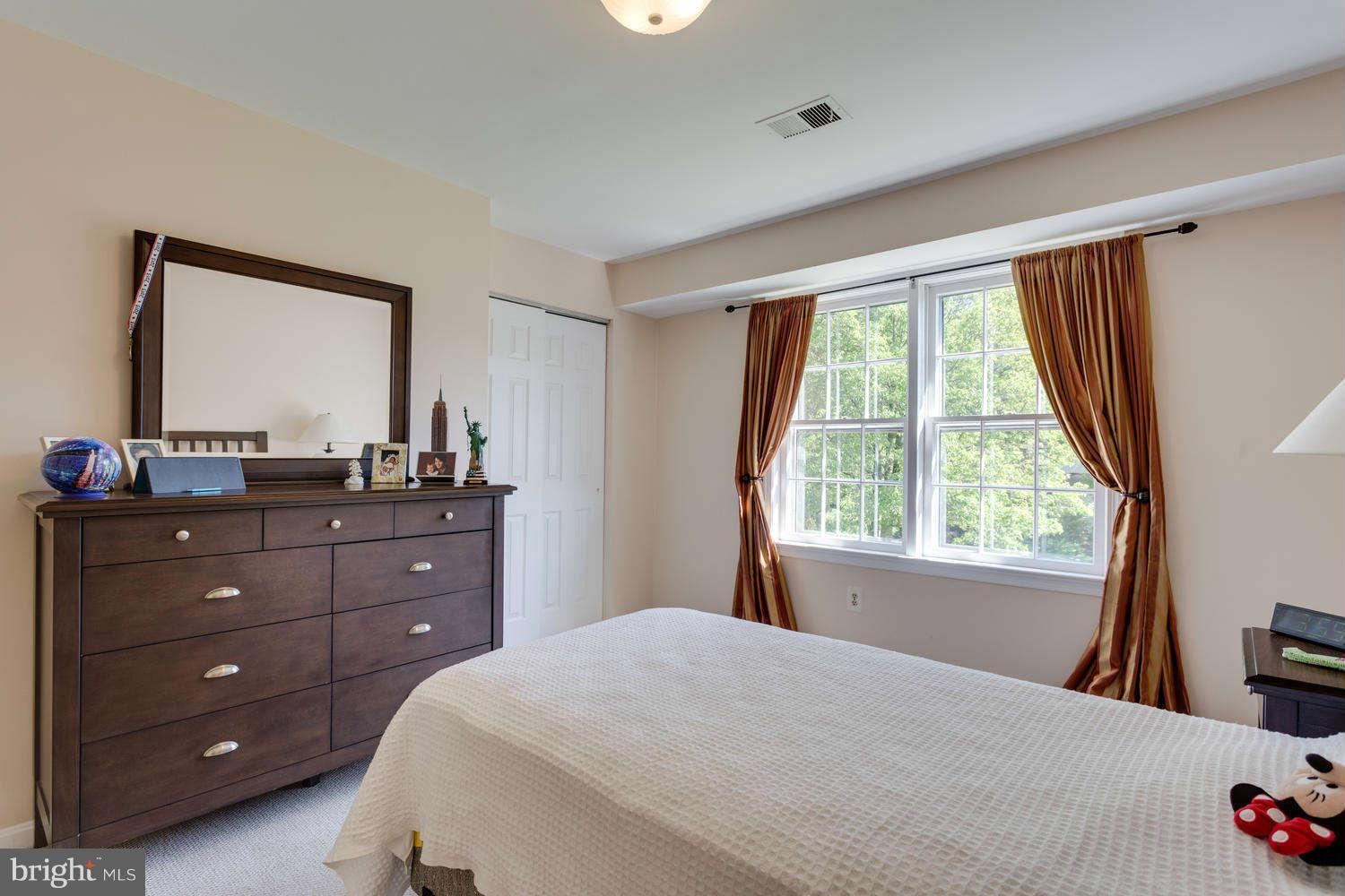 1524 Laurel Hill Road Vienna, VA 22182 - Photo 16 of 29 a bedroom with a bed and a window