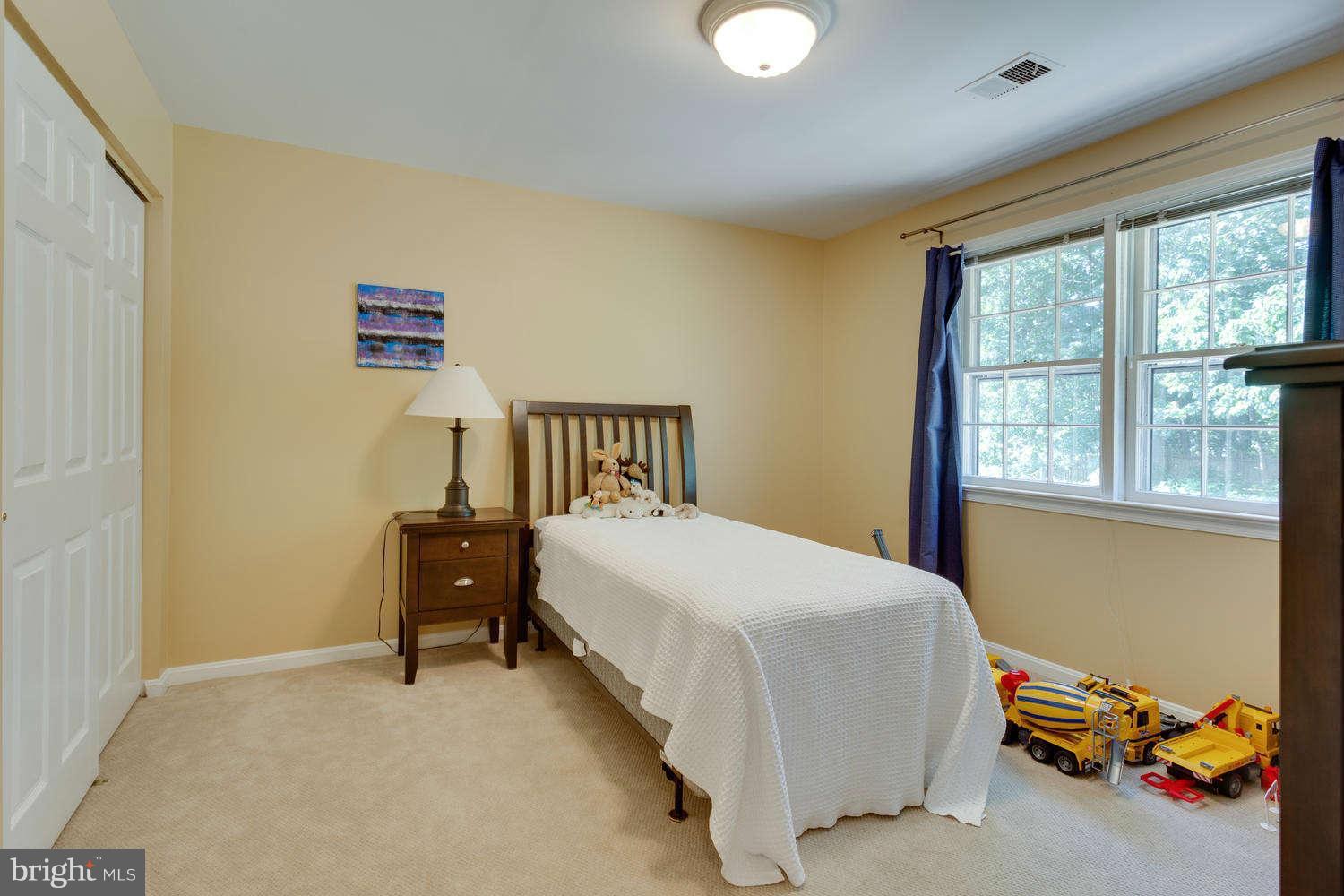 1524 Laurel Hill Road Vienna, VA 22182 - Photo 18 of 29 a bedroom with a bed and a window
