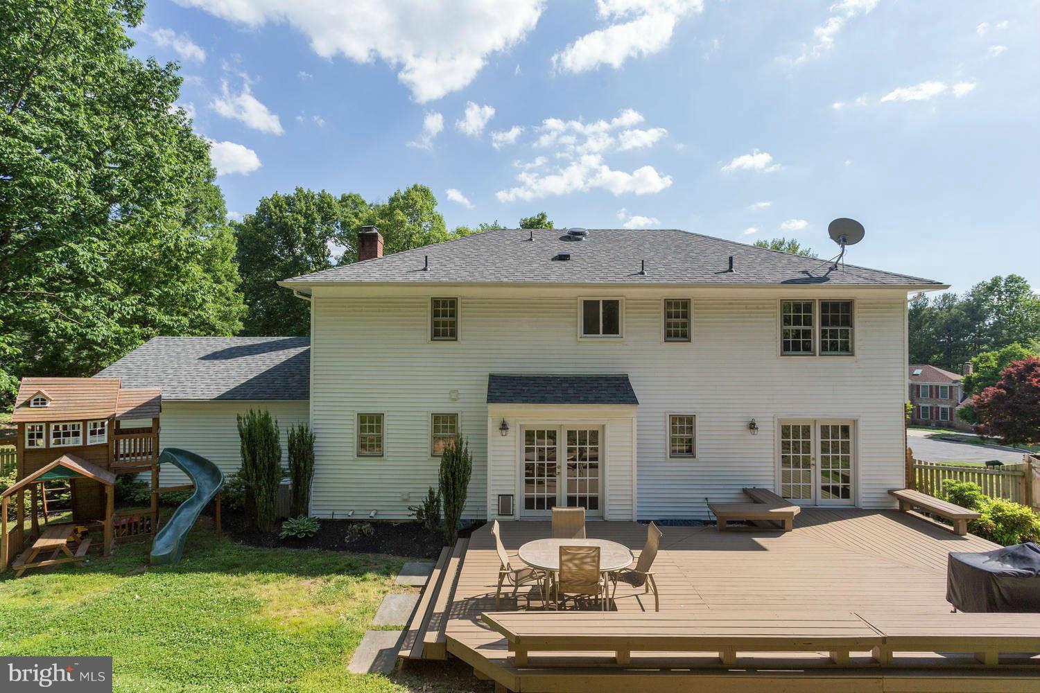 1524 Laurel Hill Road Vienna, VA 22182 - Photo 23 of 29 a view of a white house with a sink and a yard