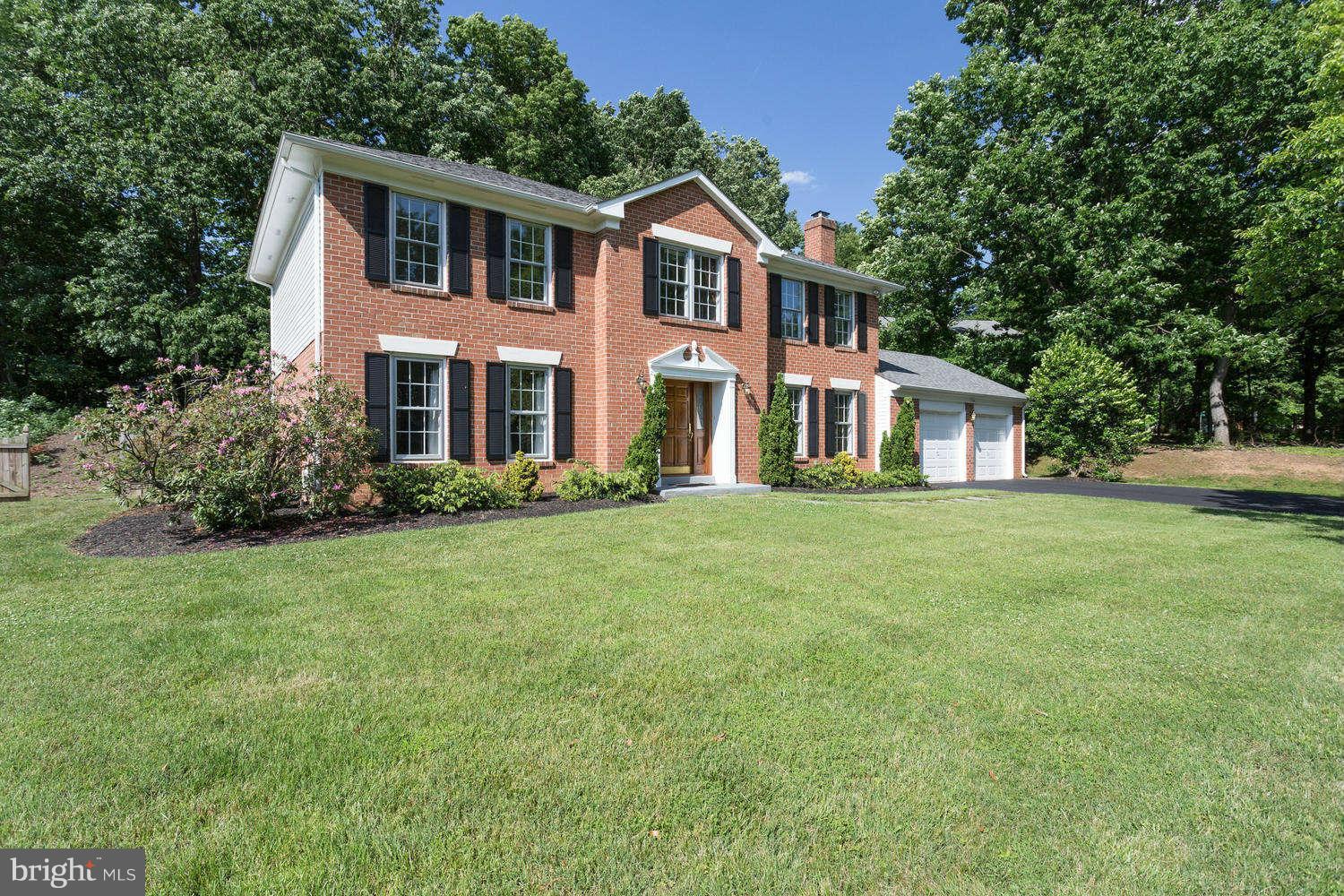 1524 Laurel Hill Road Vienna, VA 22182 - Photo 29 of 29 a front view of a house with a garden