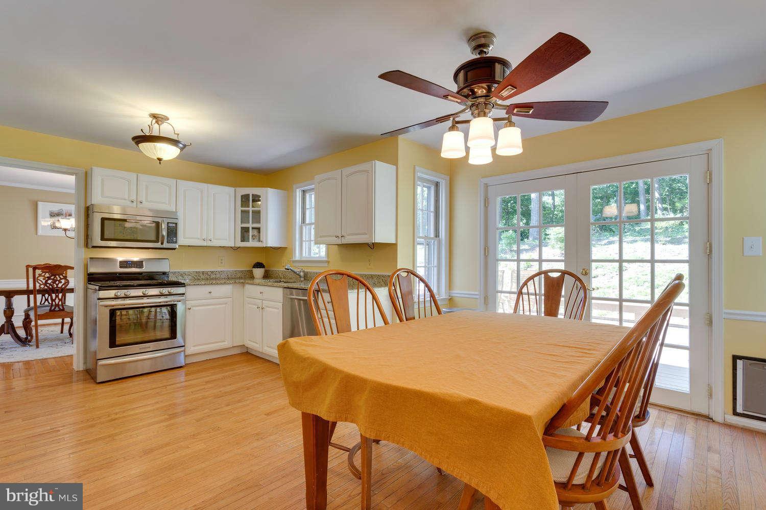 1524 Laurel Hill Road Vienna, VA 22182 - Photo 6 of 29 a view of a dining room with furniture wooden floor and chandelier