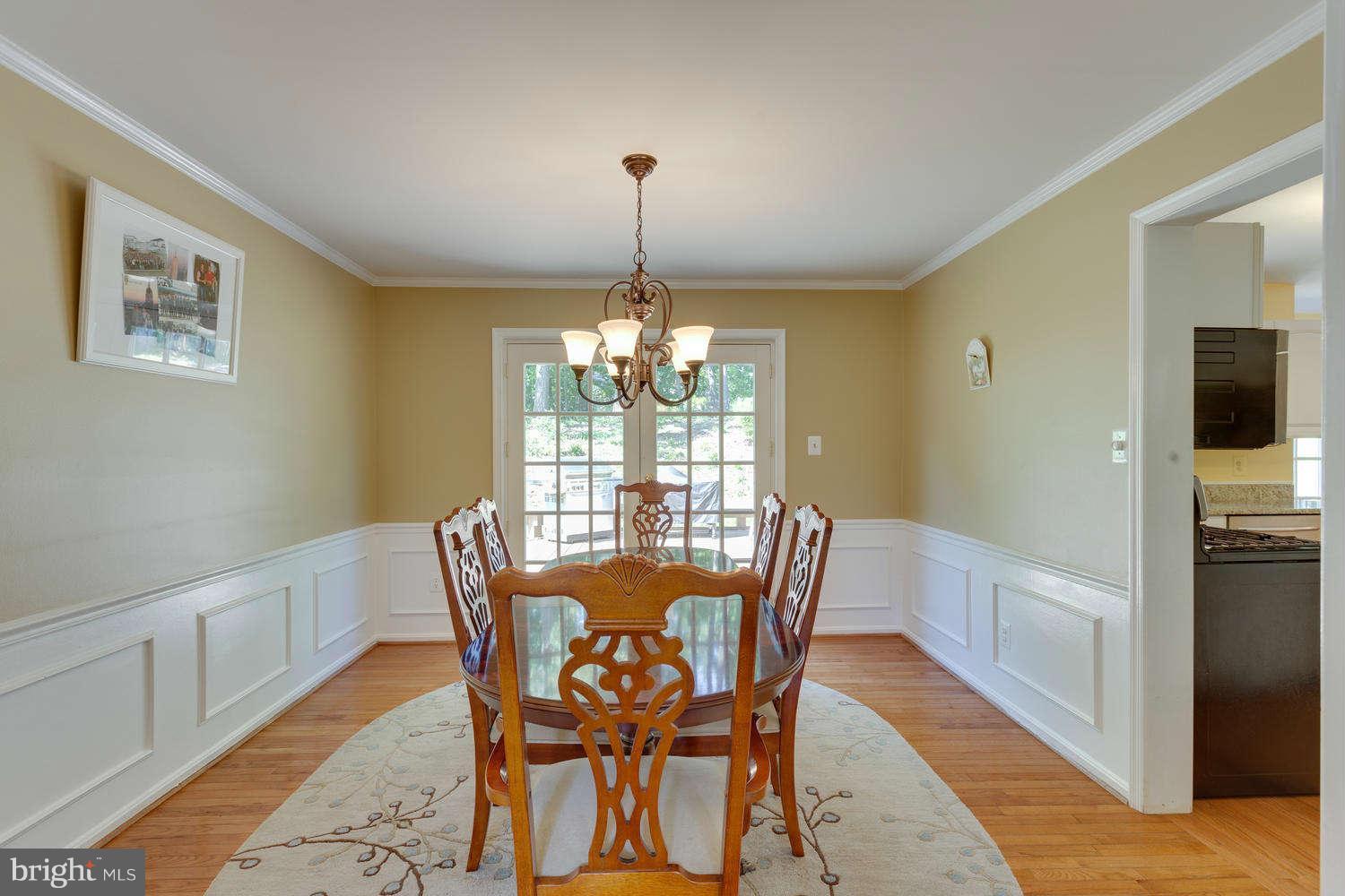 1524 Laurel Hill Road Vienna, VA 22182 - Photo 7 of 29 a view of a dining room with furniture window and wooden floor