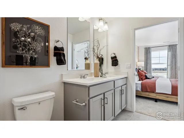 a bathroom with a sink double vanity and a mirror