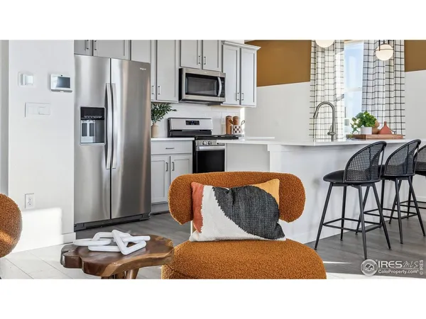 a kitchen with a dining table and chairs