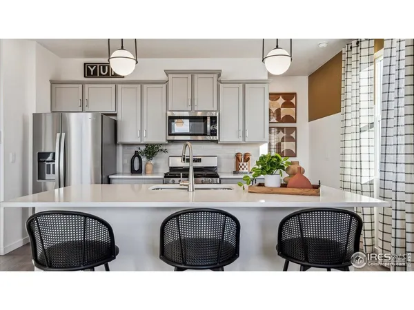 a kitchen with a sink cabinets and window
