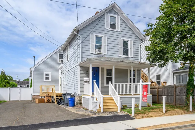 a front view of a house with a pathway