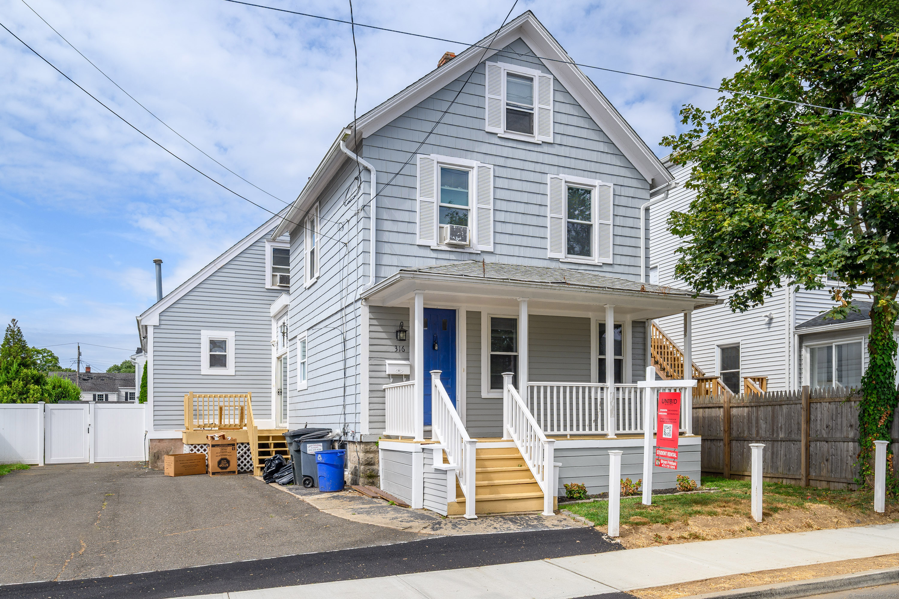 316 Reef Road Fairfield, CT 06824 - Photo 2 of 33 a front view of a house with a pathway