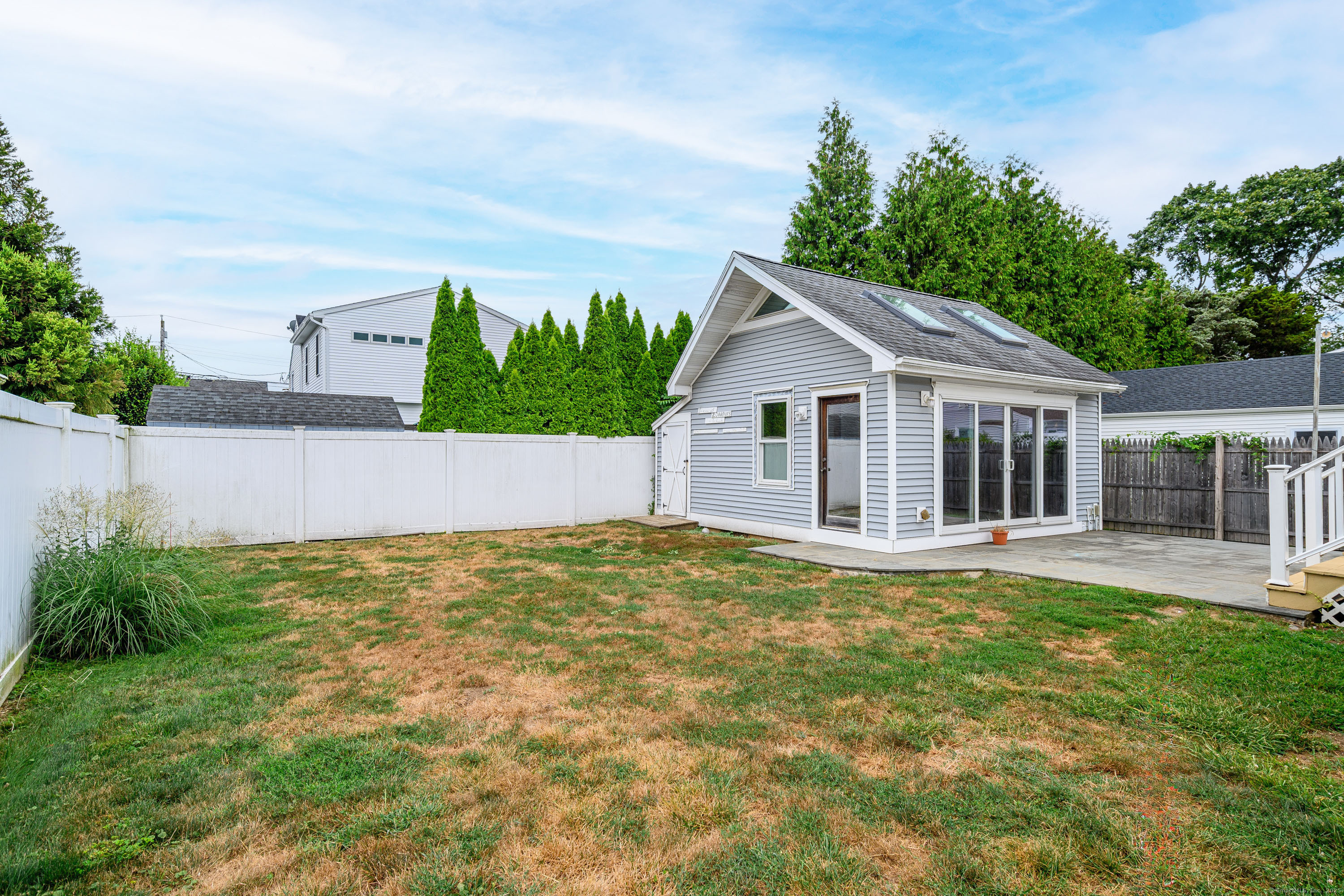 316 Reef Road Fairfield, CT 06824 - Photo 32 of 33 a view of house with backyard and garden