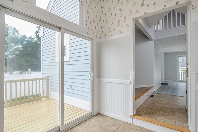 a view of a porch with wooden floor and deck