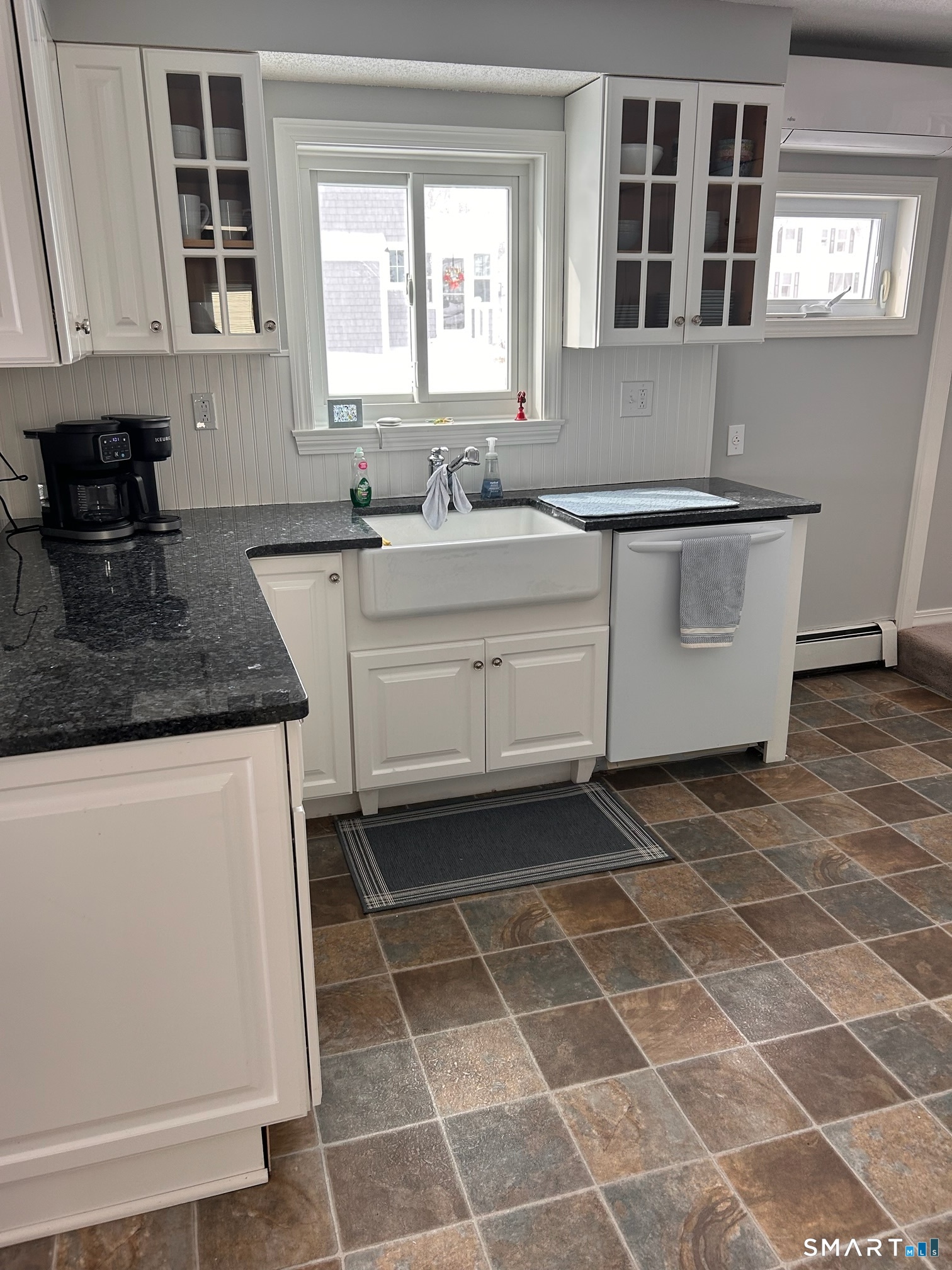 22 Indianola Road East Lyme, CT 06357 - Photo 11 of 18 a kitchen with a sink a stove and a microwave