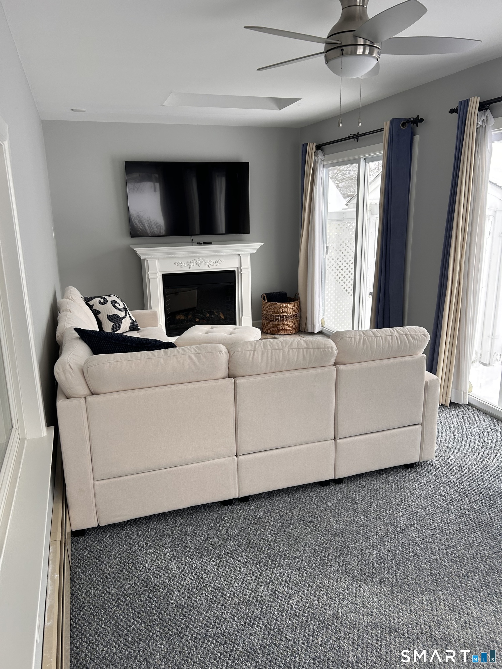 22 Indianola Road East Lyme, CT 06357 - Photo 13 of 18 a living room with furniture and a fireplace