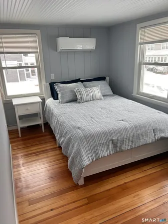 a bedroom with bed and window