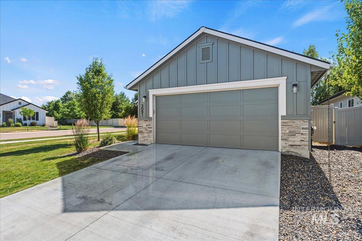 3091 S Green Boise, ID 83709 - Photo 3 of 27 Contemporary exterior featuring board and batten siding with stone accents