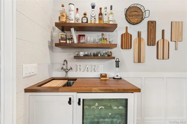 a kitchen with a sink a stove and cabinets