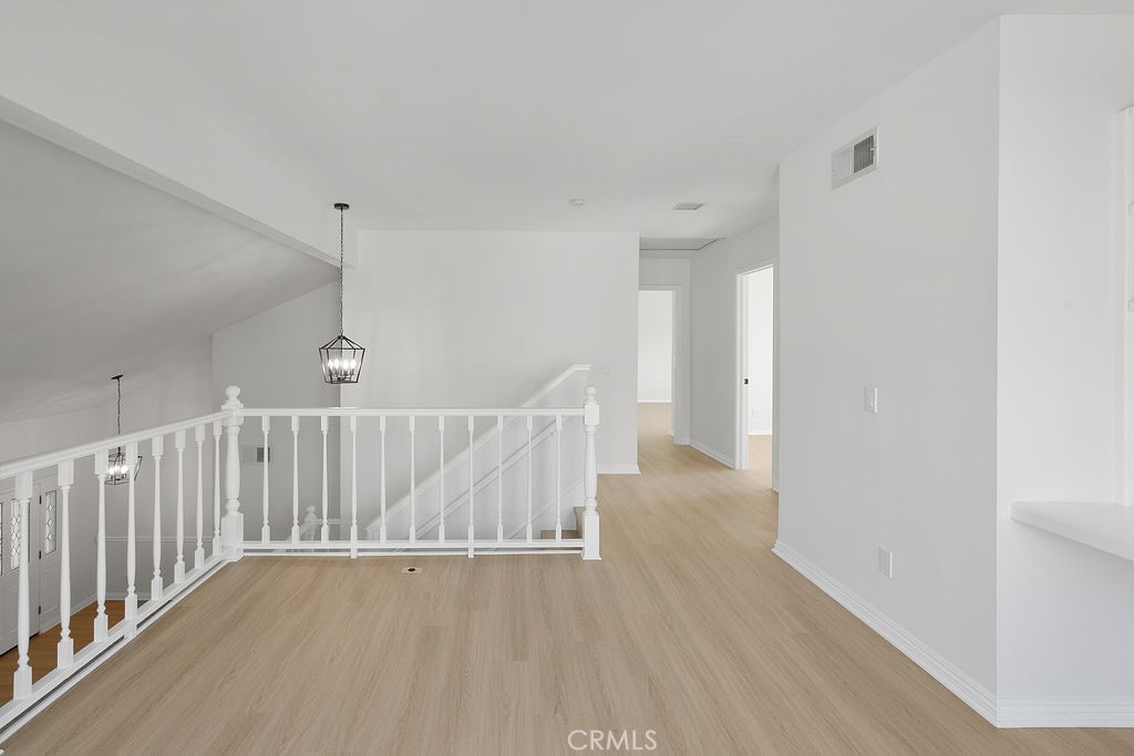 29950 Rolling Ridge Drive Agoura Hills, CA 91301 - Photo 13 of 26 a view of an empty room with wooden floor
