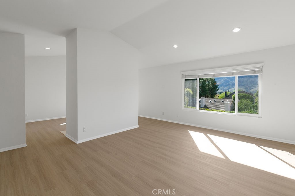 29950 Rolling Ridge Drive Agoura Hills, CA 91301 - Photo 15 of 26 wooden floor in an empty room with a window