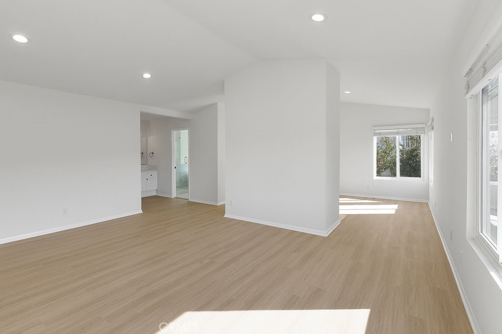 29950 Rolling Ridge Drive Agoura Hills, CA 91301 - Photo 16 of 26 a view of an empty room with wooden floor and a window