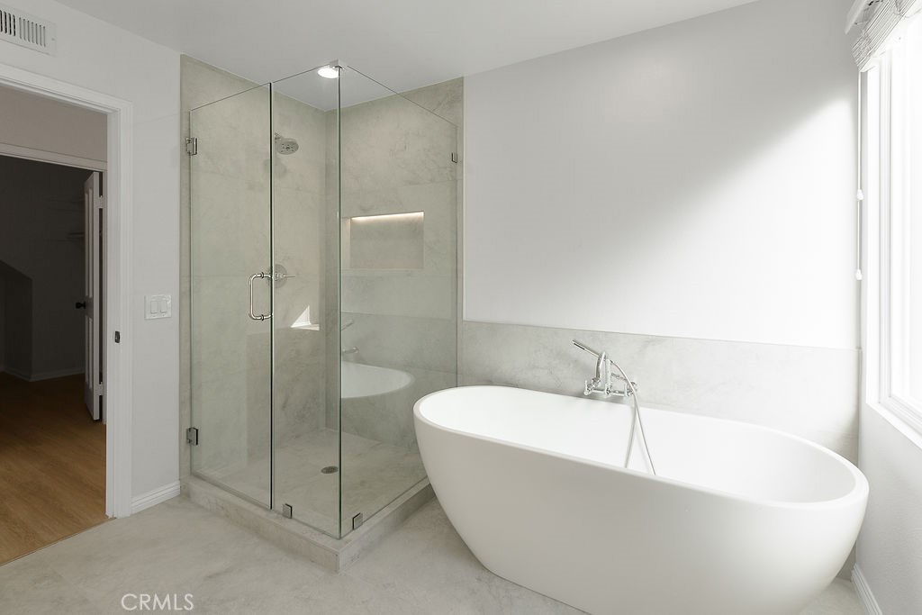 29950 Rolling Ridge Drive Agoura Hills, CA 91301 - Photo 17 of 26 a white bath tub sitting next to a shower