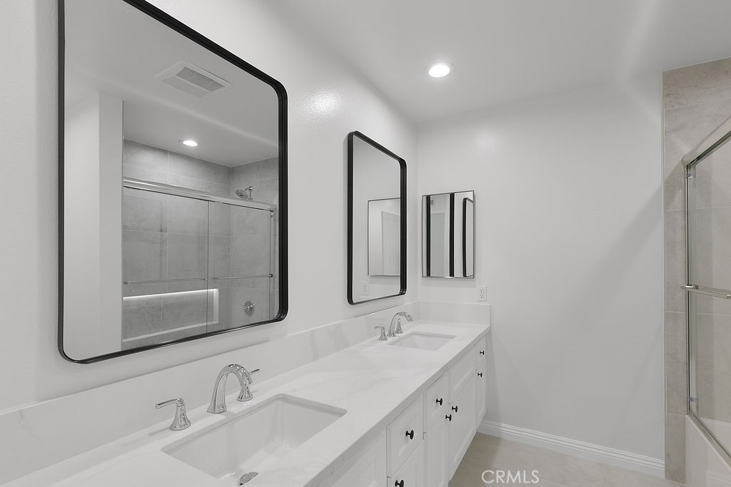 29950 Rolling Ridge Drive Agoura Hills, CA 91301 - Photo 22 of 26 a bathroom with double vanity sink and two mirror