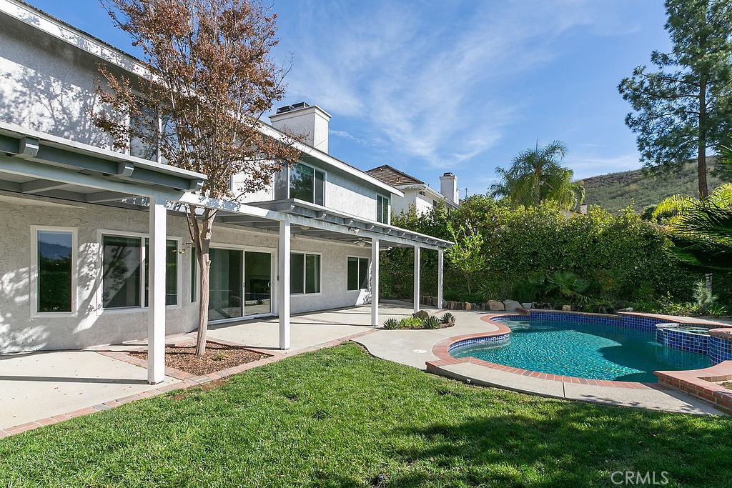 29950 Rolling Ridge Drive Agoura Hills, CA 91301 - Photo 25 of 26 a view of a house with sitting area and garden