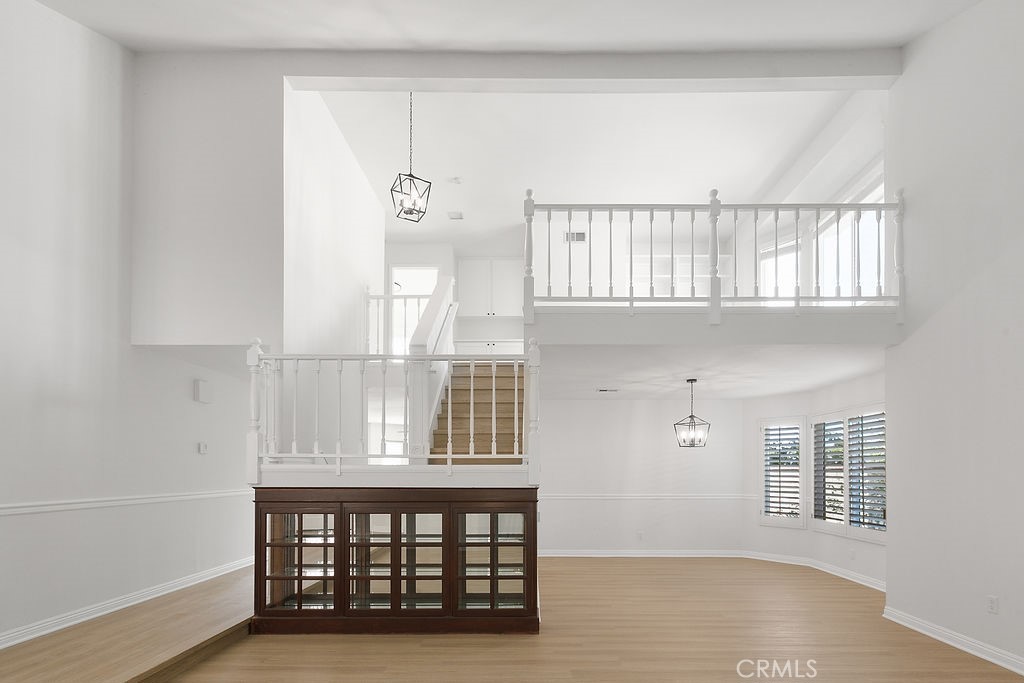 29950 Rolling Ridge Drive Agoura Hills, CA 91301 - Photo 3 of 26 a view of an empty room with wooden floor and a window