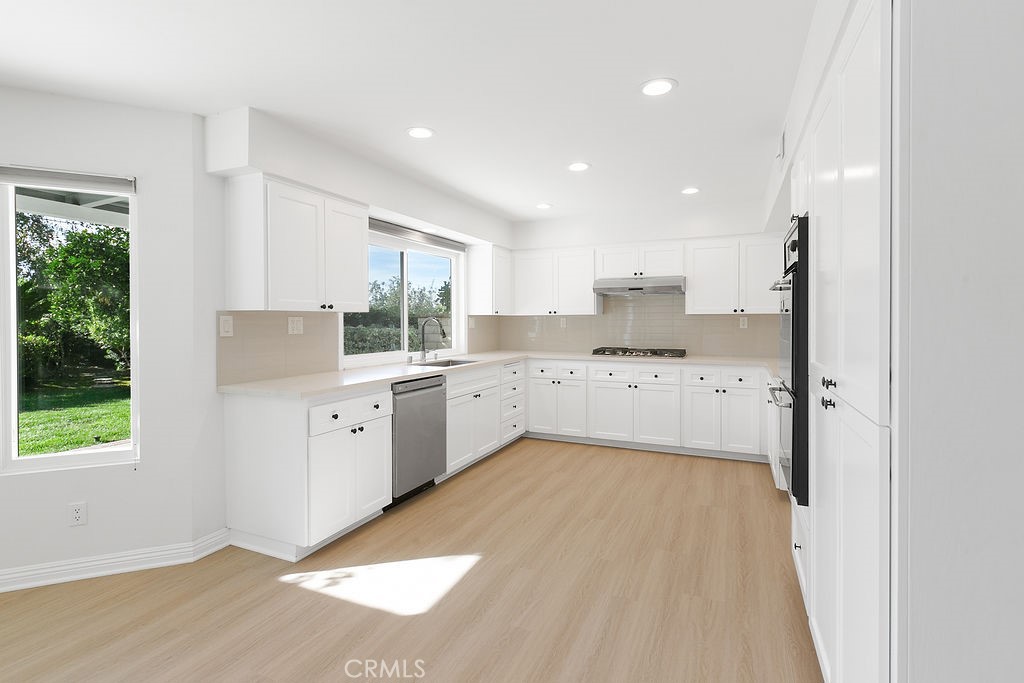 29950 Rolling Ridge Drive Agoura Hills, CA 91301 - Photo 8 of 26 a kitchen with a sink a window and cabinets