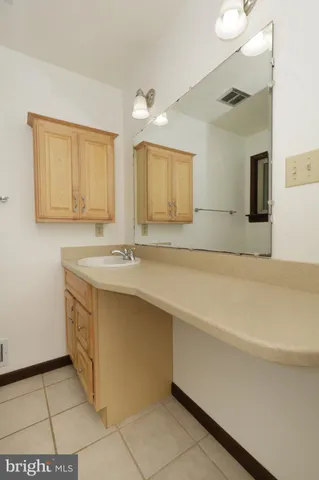a view of storage and utility room with washer and dryer