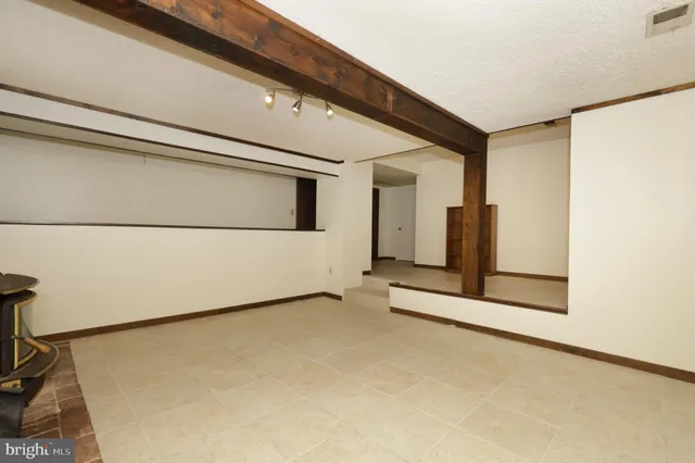 a balcony with wooden floor and fence