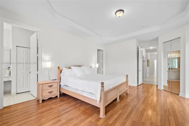 a large white bed in a white room