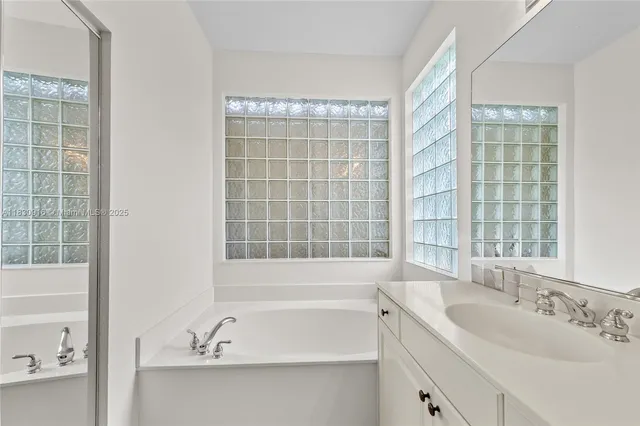a bathroom with sink shower and bathtub