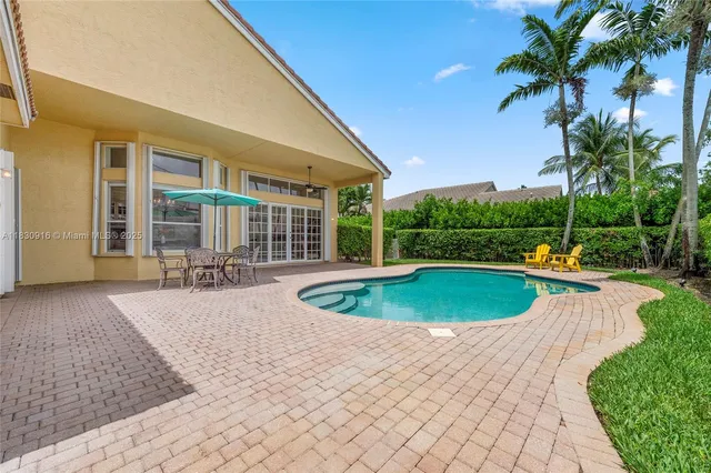 a view of a swimming pool with a patio
