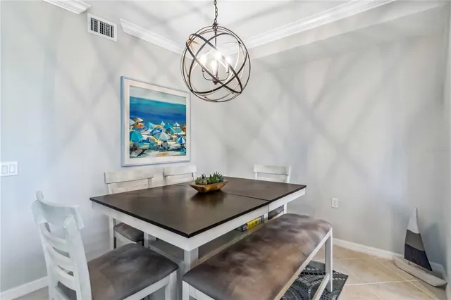 a view of dining table and chairs in a room