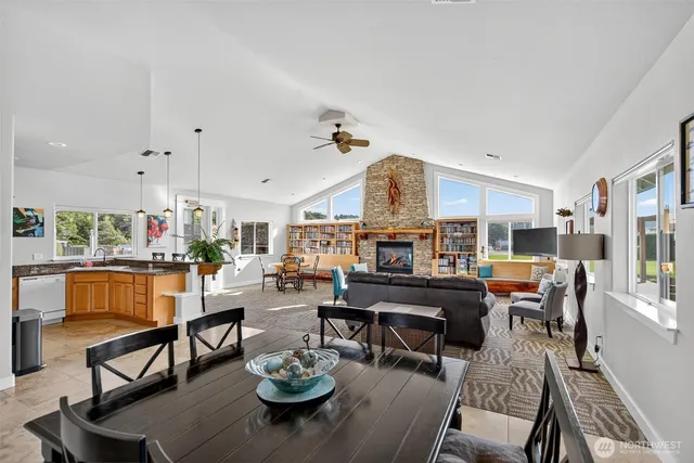 a living room with furniture kitchen view and a table